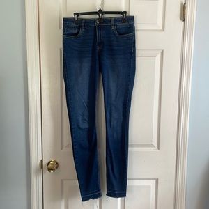 PROSPERITY Size 30 fringe hem dark wash jeans.